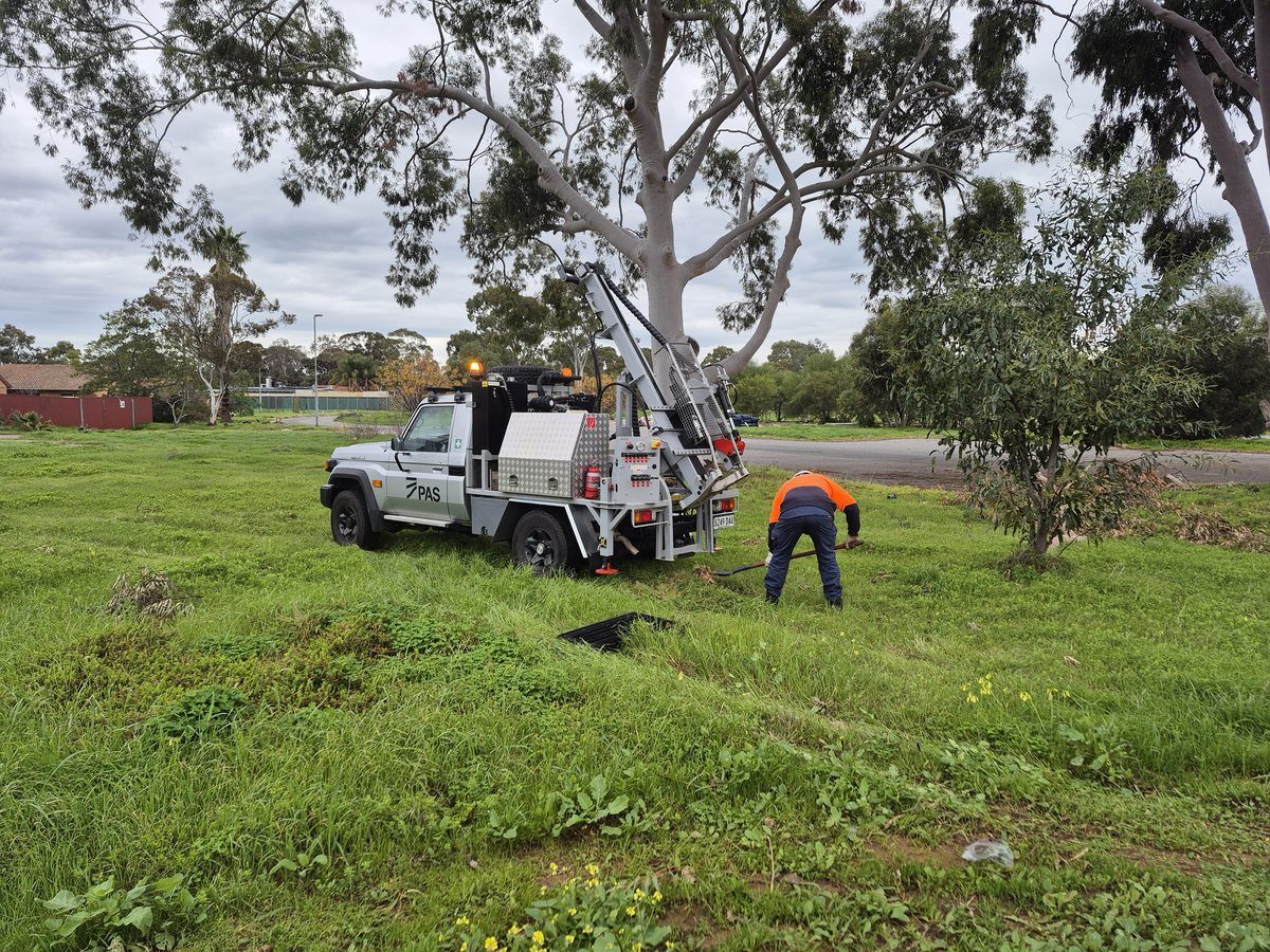 Push tube drilling rig advancing soil bore on the former shopping centre site — Elizabeth Grove SA