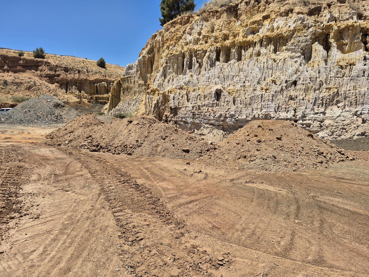 Stockpile of excavated natural soils at bulk fill rehabilitation site — looking east