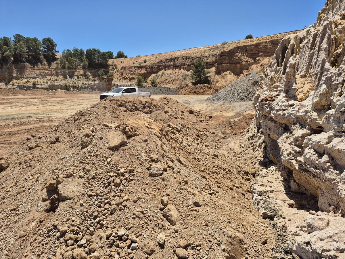 Stockpile at rehabilitation site, looking north-east — quarry escarpment in background
